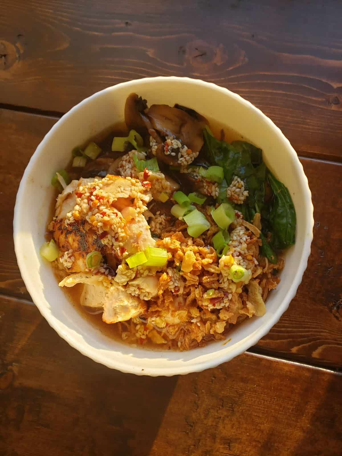 Chicken Ramen in a Shoyu-Style Broth with Mushrooms, Chili Garlic Oil & Crispy Onions