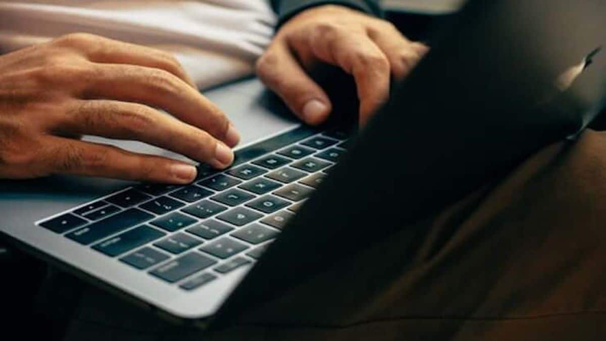 person using laptop to make money answering questions