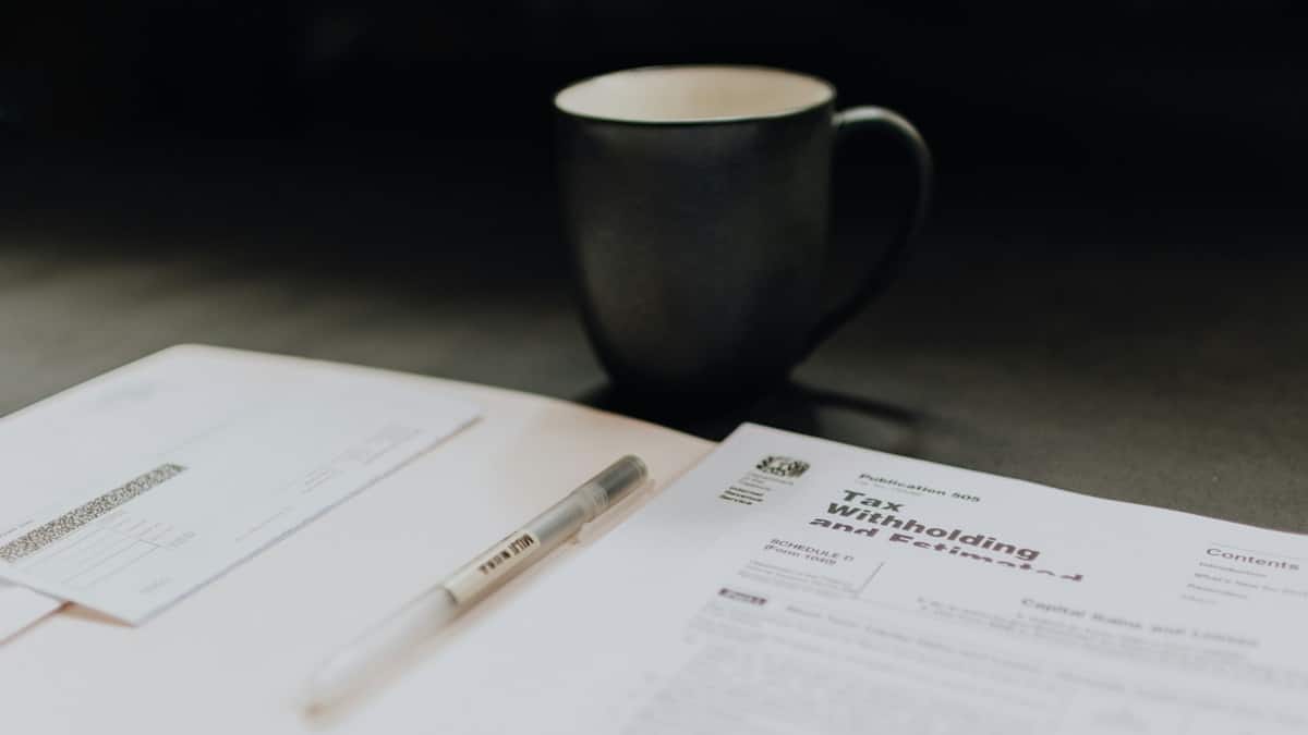 taxes on table with mug